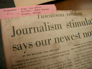 'newspaper clippings shelftop (detail)' by carmichaellibrary on Flickr (CC-BY)